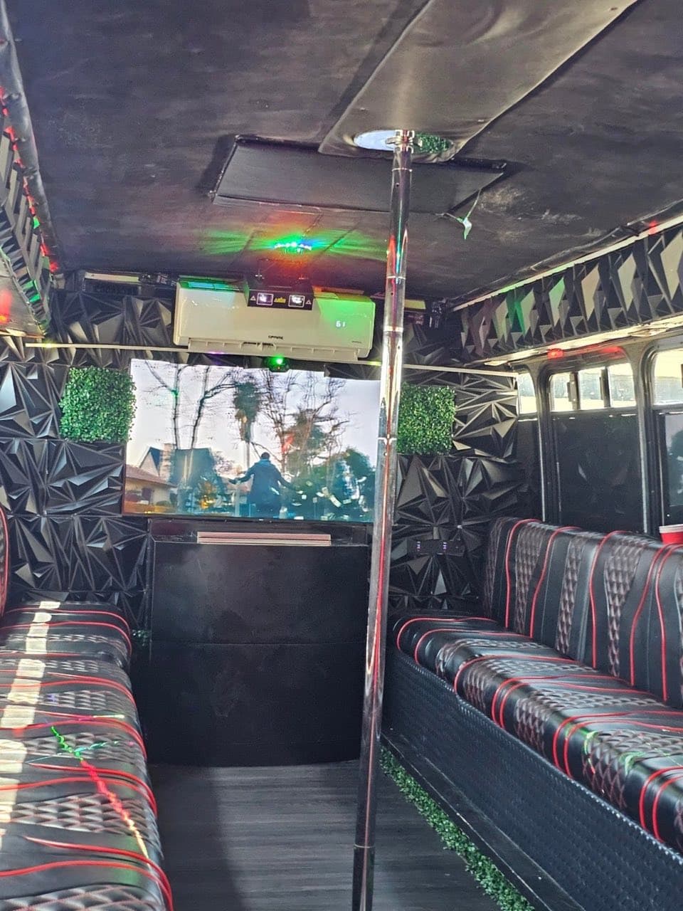Dance pole inside the LYTT party bus